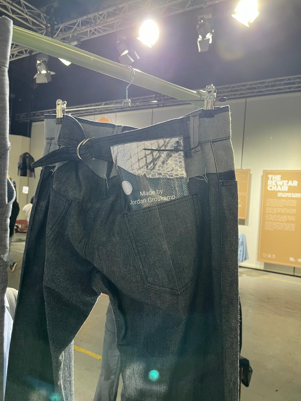 The jeans up close, with the woven label