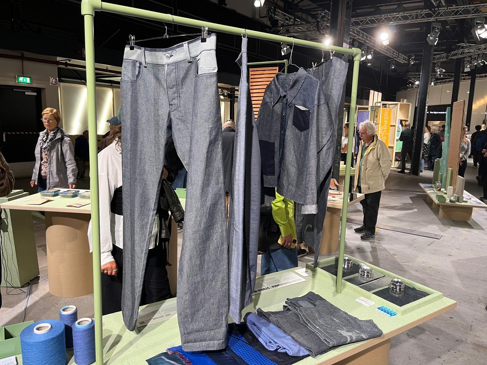 Jeans, woven panels and yarn on the podium